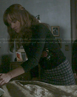 Emma's bird embroidered cardigan and grey checked skirt on Bates Motel