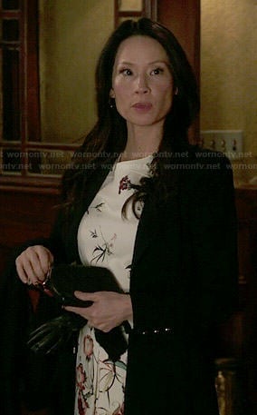 Joan's floral dress and black coat on Elementary