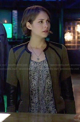 Thea's olive green jacket with leather trim and paisley printed top on Arrow