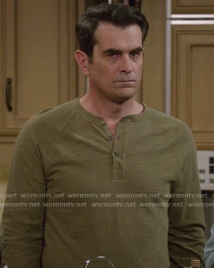 Phil's olive green henley tee on Modern Family