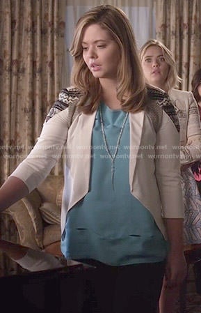 Ali's blue cutout top and white jacket on Pretty Little Liars