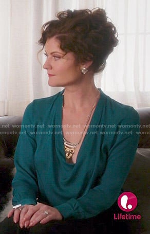 Evelyn's teal cowl neck blouse on Devious Maids