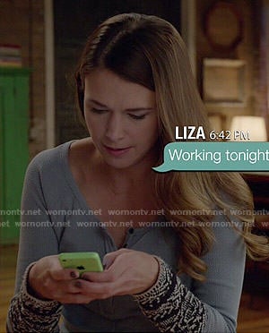 Liza's blue embroidered cuff henley top and buckled Uggs on Younger