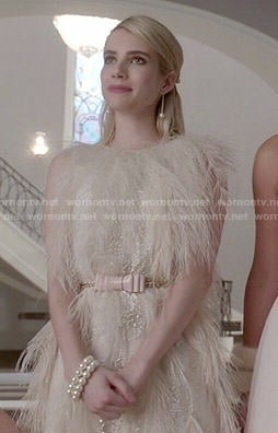 Chanel's cream feather dress and pink bow belt on Scream Queens