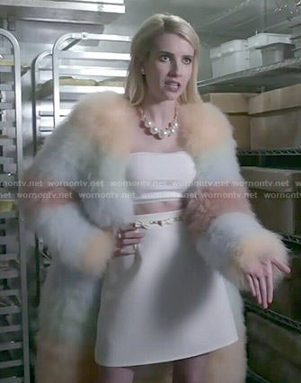 Chanel's rainbow striped fur coat and white crop top and skirt on Scream Queens