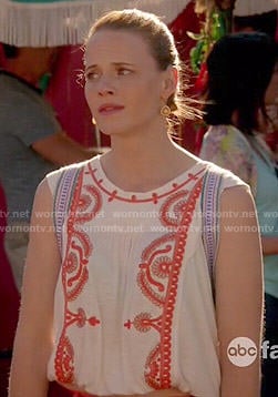 Daphne's white top with red embroidery on Switched at Birth