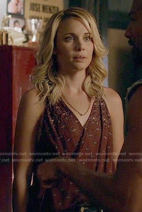 Camille's burgundy printed wrap top on The Originals