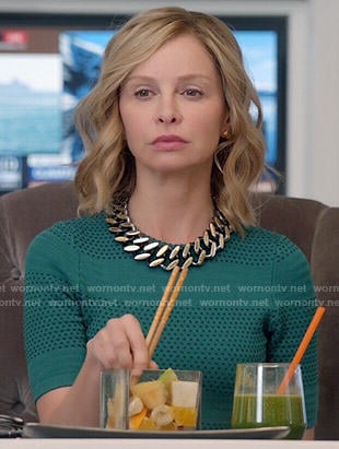 Cat's green perforated dress on Supergirl