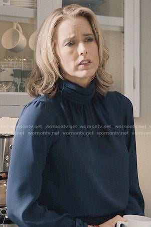 Elizabeth's navy blue turtleneck blouse on Madam Secretary