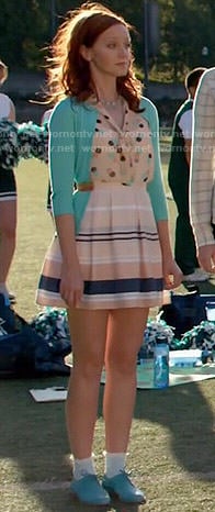 Cassandra's polka dot top, blue cardigan and striped skirt on The Librarians
