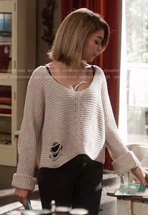 Haley's grey ripped sweater on Modern Family