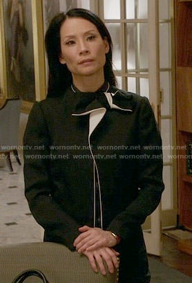 Joan's black bow jacket with white trim on Elementary