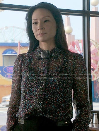 Joan's confetti print blouse on Elementary