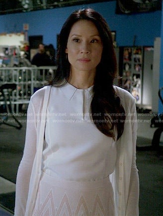 Joan's white collared top and chevron print skirt on Elementary