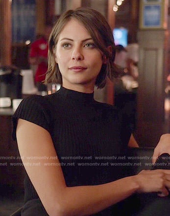 Thea's black mock-neck top on Arrow