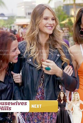 Phoebe's printed dress and leather jacket on Girlfriends Guide to Divorce
