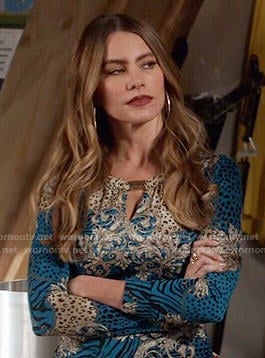 Gloria's blue animal and flourish print top with cutout neckline on Modern Family