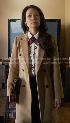Joan's long camel coat on Elementary