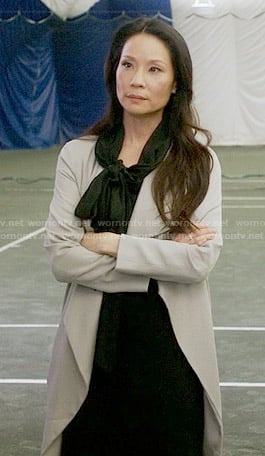 Joan's off-white draped coat on Elementary