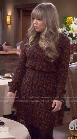 Kristin's black and orange printed long sleeve dress on Last Man Standing