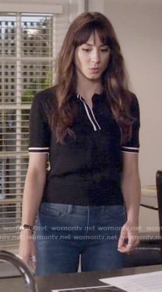 Spencer's black polo top with white trim on Pretty Little Liars