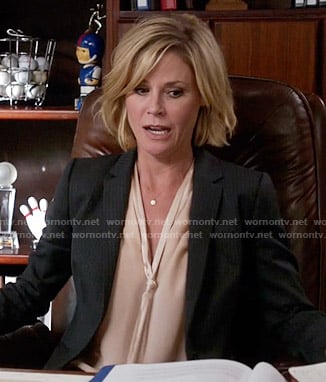 Claire's blush pink neck-tie blouse on Modern Family