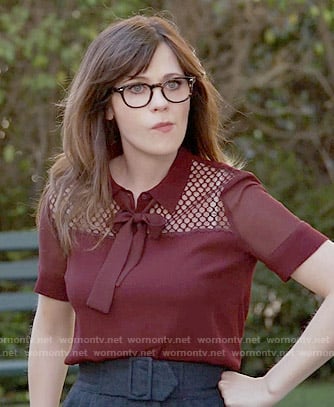 Jess's red tie-neck blouse on New Girl