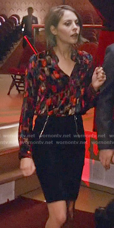 Thea's printed blouse and black zipper front skirt on Arrow