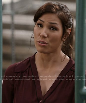 Angela's burgundy blouse with black piping on Bones
