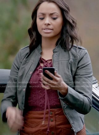Bonnie's pink lace up sweater, leather jacket and tan button front skirt on The Vampire Diaries
