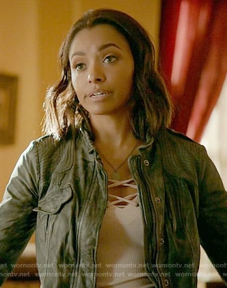 Bonnie's white lace-up top and grey leather jacket on The Vampire Diaries