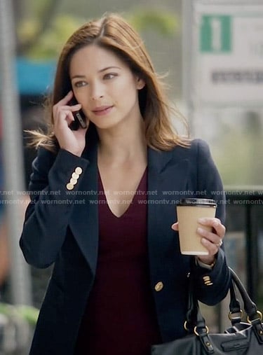 Cat's navy blazer with gold buttons on Beauty and the Beast