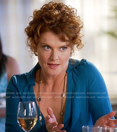 Evelyn's blue draped neck blouse on Devious Maids