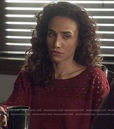 Tess's red perforated sweater on Beauty and the Beast