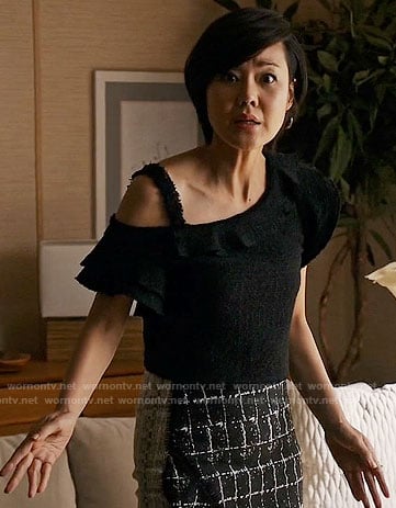 Karen's black ruffled tweed top and checked skirt on Mistresses