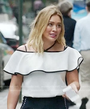 Kelsey's white ruffled off-shoulder top on Younger