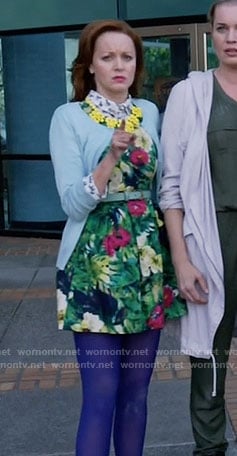 Cassandra's green floral dress and blue cardigan on The Librarians
