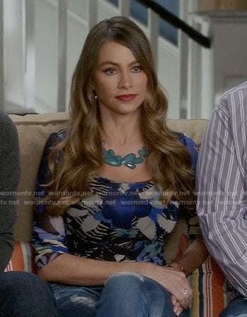 Gloria's blue floral print long sleeve top on Modern Family