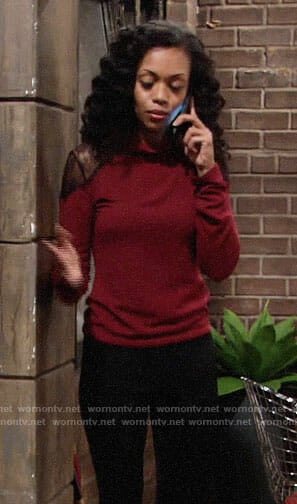 Hilary's red turtleneck with black lace shoulders on The Young and the Restless
