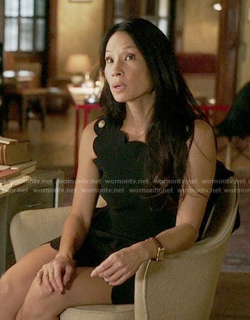 Joan's black scalloped trim dress on Elementary