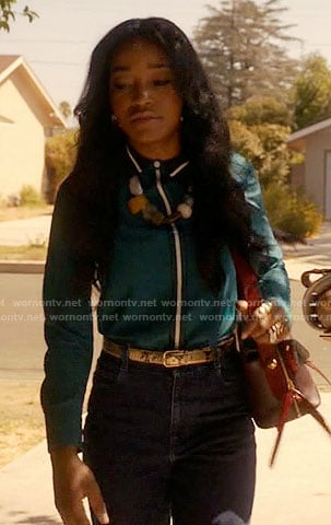 Zayday's teal green shirt with white trim on Scream Queens