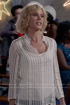 Claire's white vertical striped top on Modern Family
