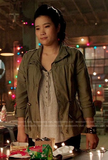 Happy's grey henley top and green jacket on Scorpion