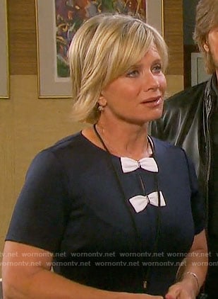 Kayla's navy dress with two white bows on Days of our Lives