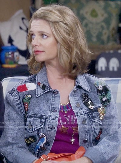 Kimmy's embellished denim jacket and red cat purse on Fuller House