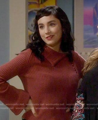 Mandy's pink asymmetrical neck sweater on Last Man Standing