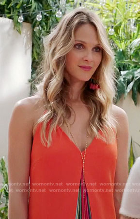 Phoebe's orange dress with rainbow pleats on Girlfriends Guide to Divorce