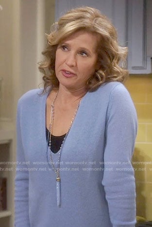Vanessa's blue v-neck sweater on Last Man Standing