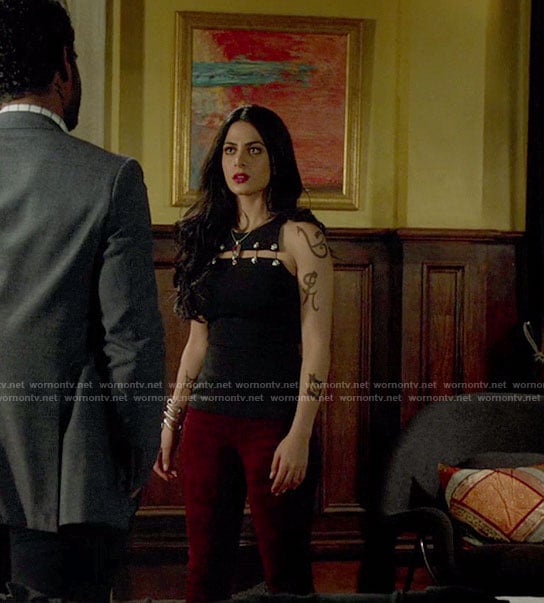 Isabelle's black cutout top with safety pins and suede pants on Shadowhunters