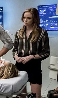 Caitlin's green striped shirt and black scalloped skirt on The Flash